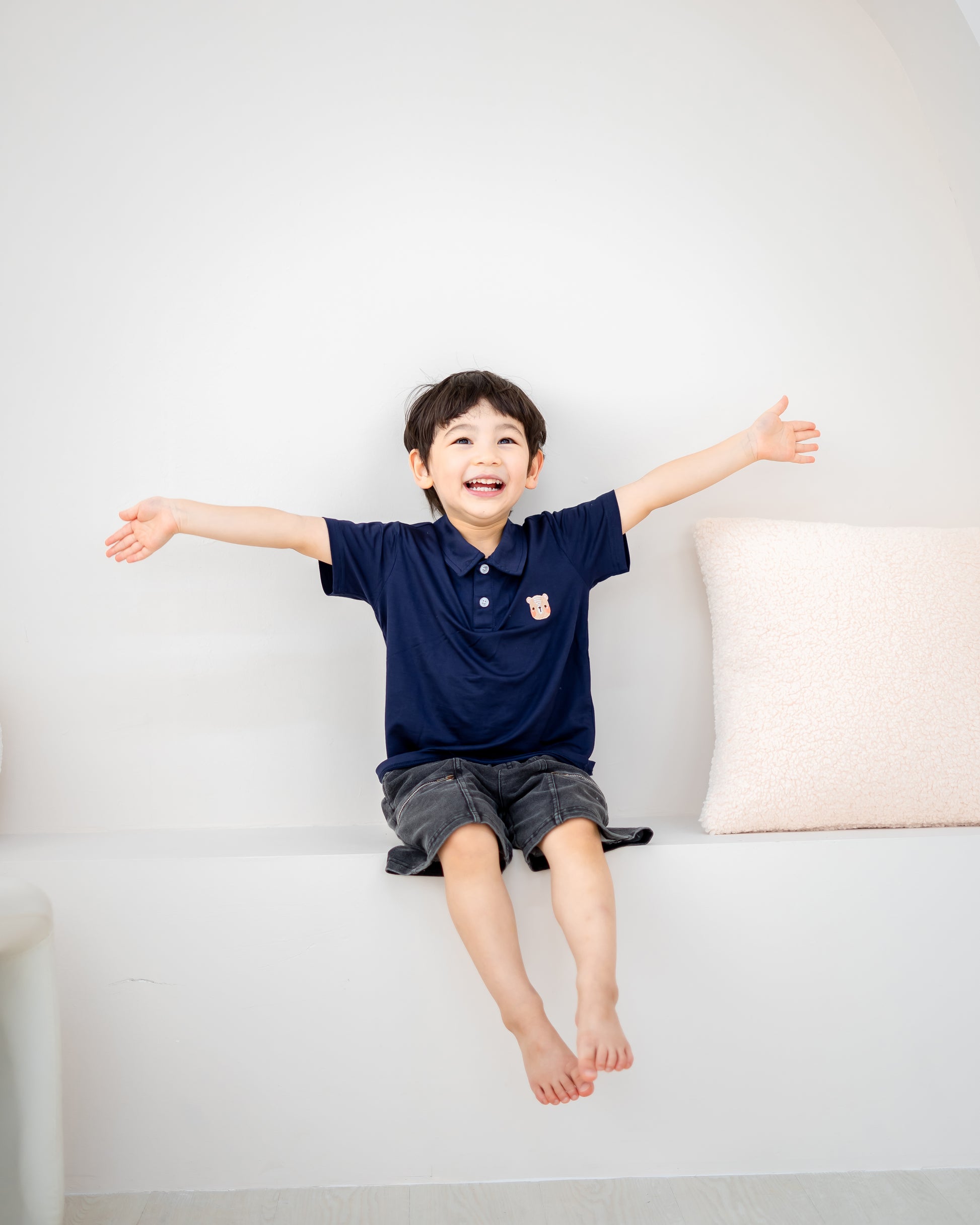 LeBear kids TENCEL™ polo shirt navy playful boy arms open soft breathable comfortable kids outfit Singapore