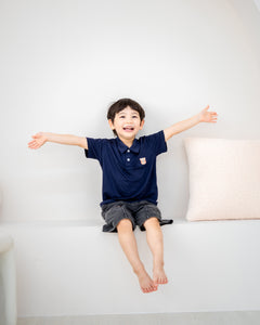 LeBear kids TENCEL™ polo shirt navy playful boy arms open soft breathable comfortable kids outfit Singapore