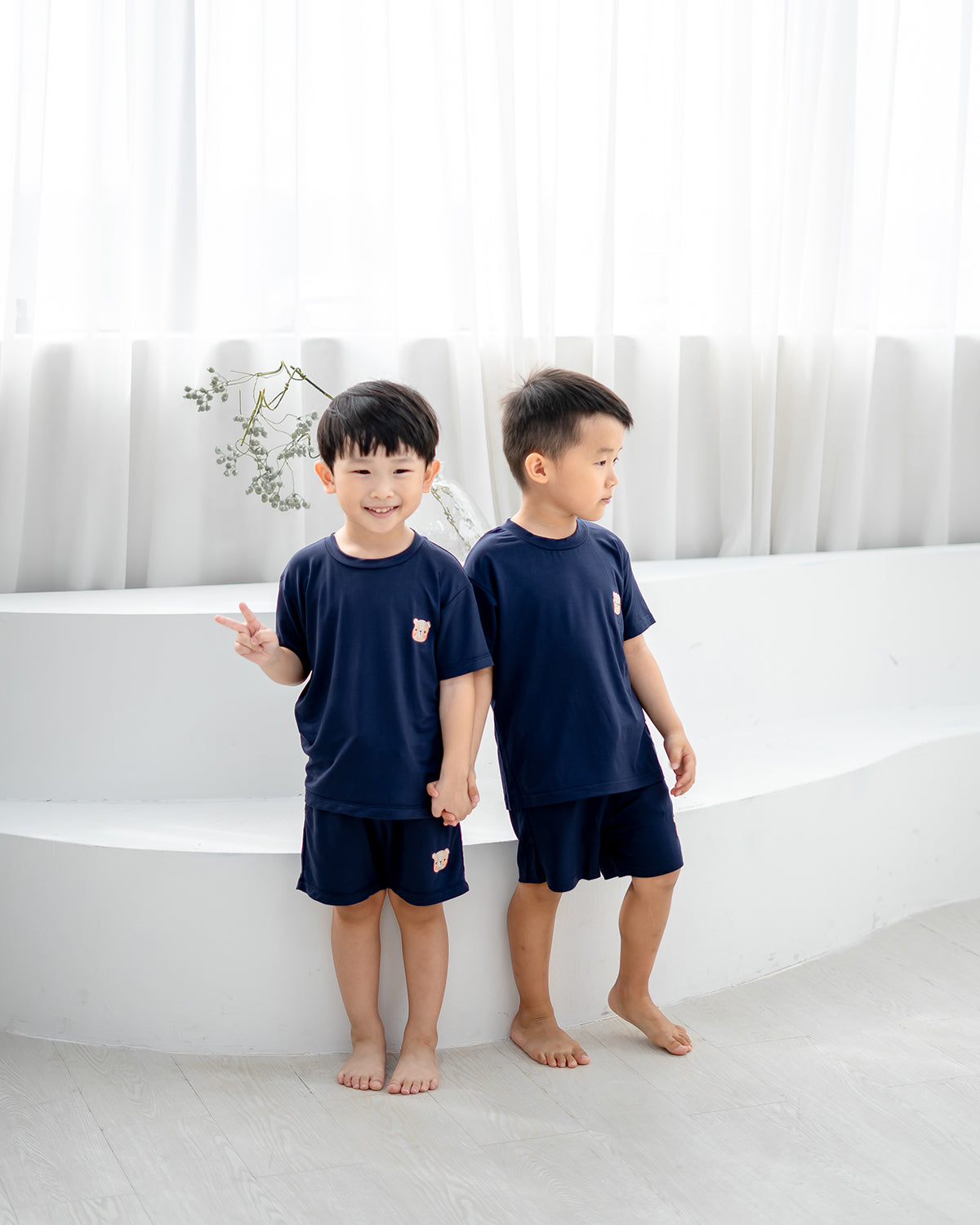 Comfortable kids navy TENCEL™ loungewear set featuring the LEBEAR bear embroidery.