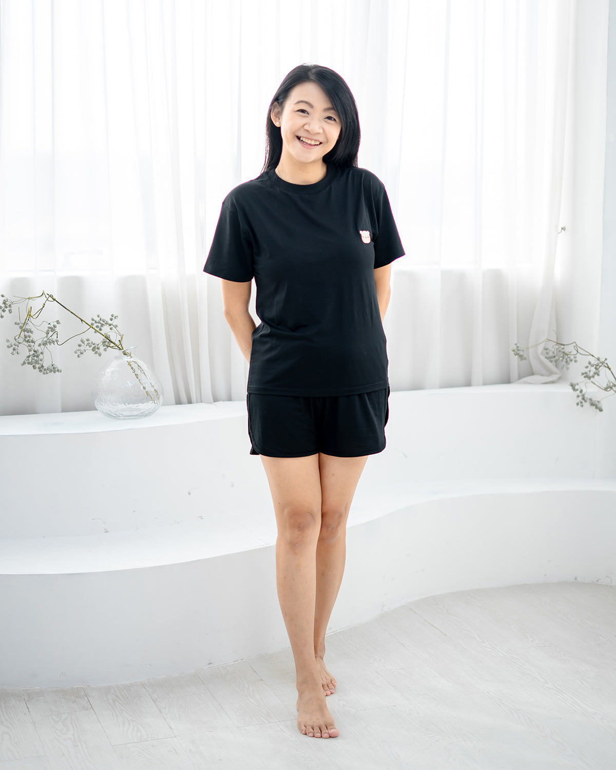 Woman smiling in LEBEAR Ladies TENCEL™ Set in Black — tag-less premium loungewear Singapore.