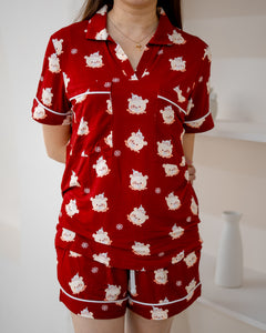 Close-up of LeBear Little Dreamer buttonless bamboo pyjamas in Festive Red with bear and snowflake print