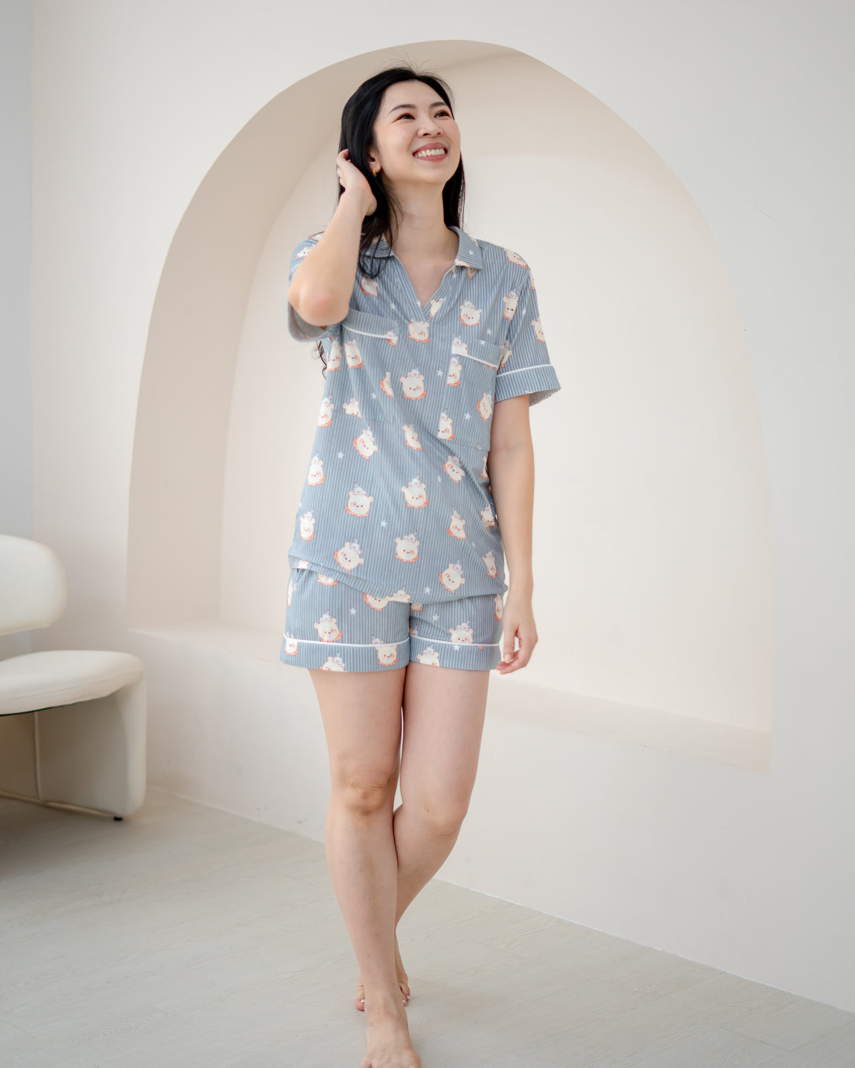 Woman wearing LeBear Little Dreamer buttonless bamboo pyjamas shorts set in Cloud Blue