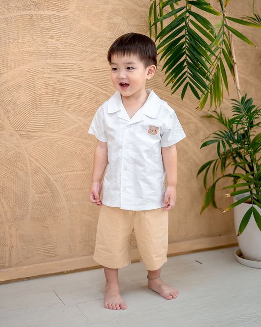 “Boy wearing LeBear Maison Camp Collar Shirt in White – premium cotton boys shirt Singapore”