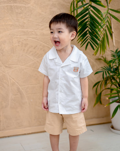 “Smiling boy in LeBear White Maison Camp Collar Shirt – kids festive outfit”