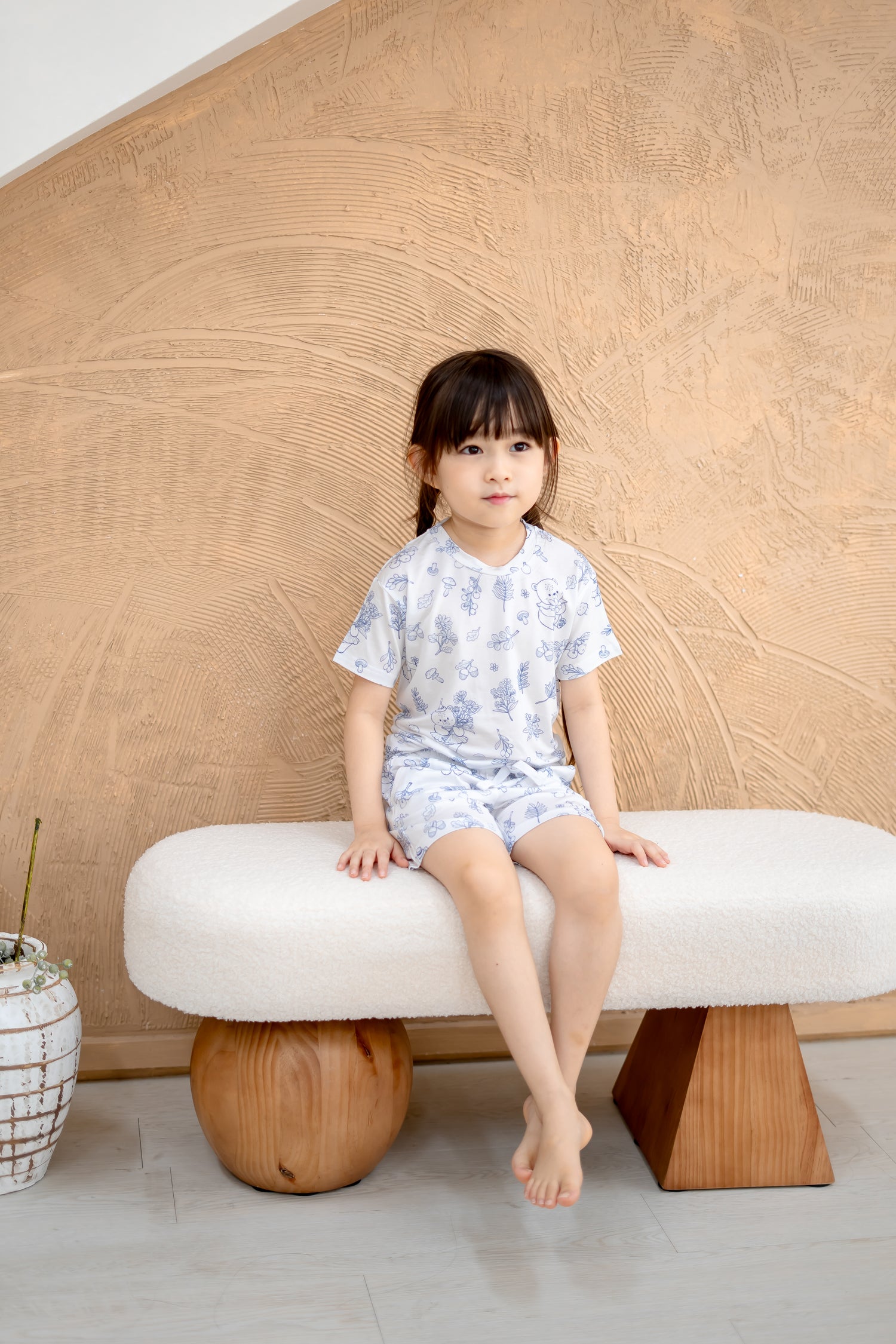 Full body view of child in LeBear Meadow Blue TENCEL kids set