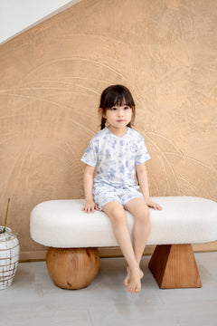 Full body view of child in LeBear Meadow Blue TENCEL kids set