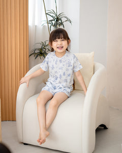 Child wearing LeBear Meadow Blue TENCEL kids set with floral bear print