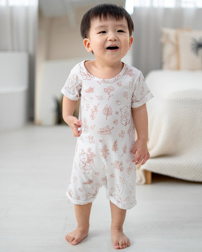 Baby wearing LeBear Meadow Mocha TENCEL baby romper with floral bear print