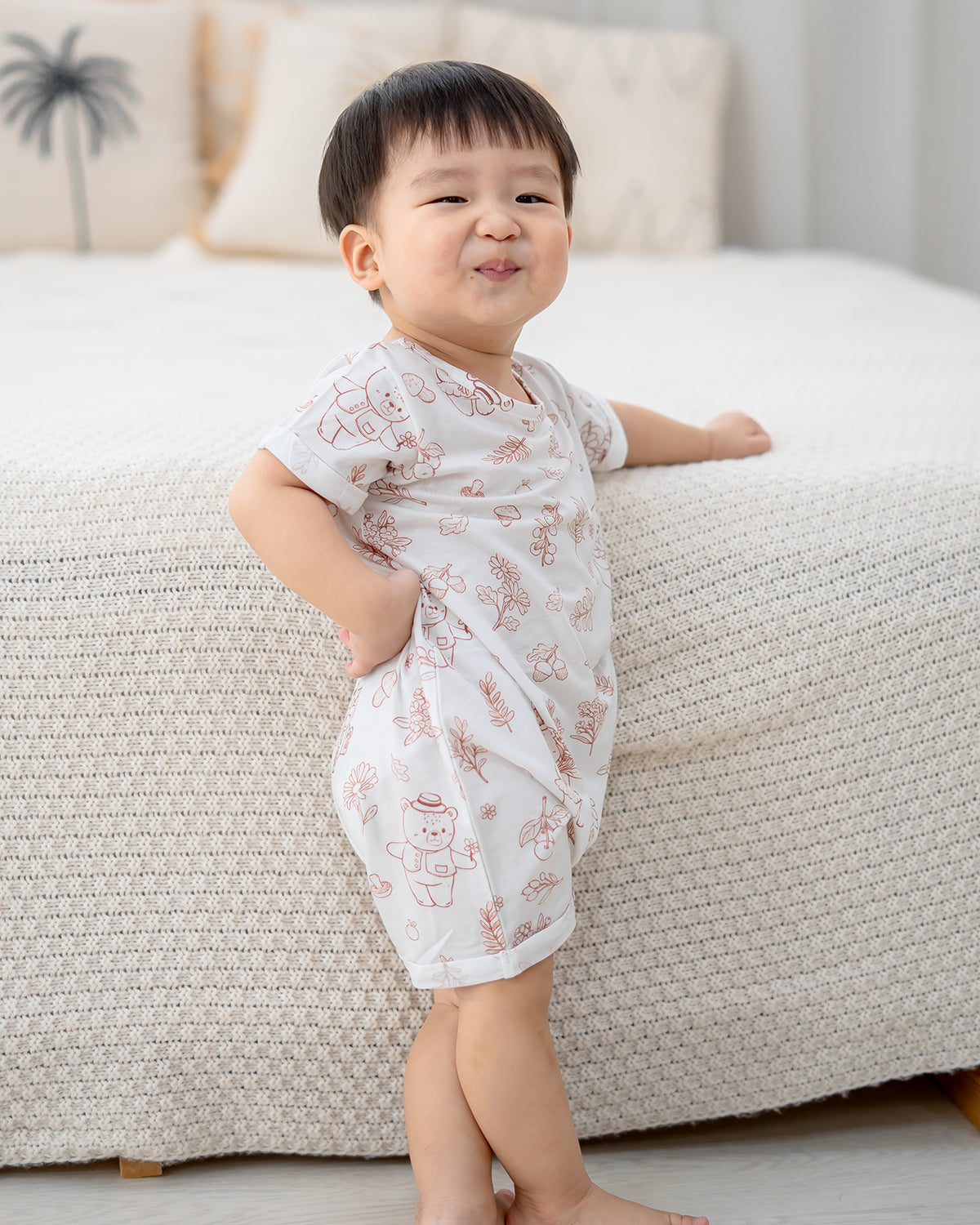 Baby walking in LeBear Meadow Mocha baby romper made with breathable TENCEL
