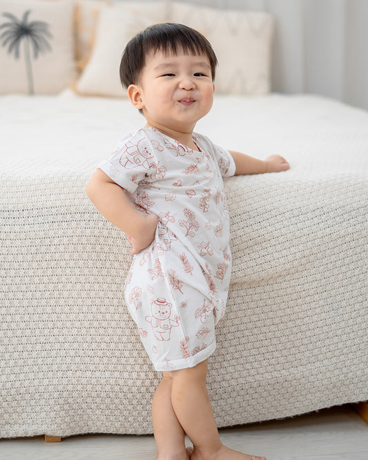 Baby walking in LeBear Meadow Mocha baby romper made with breathable TENCEL