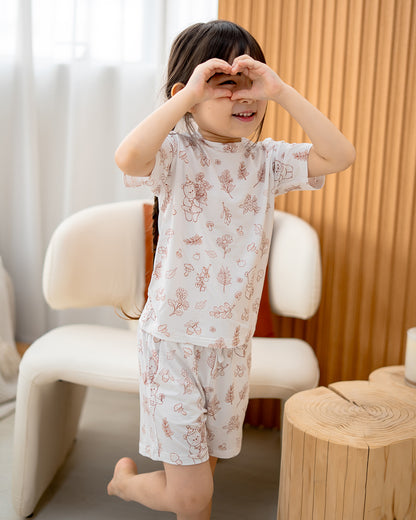 Child playing while wearing LeBear Meadow Mocha TENCEL kids set