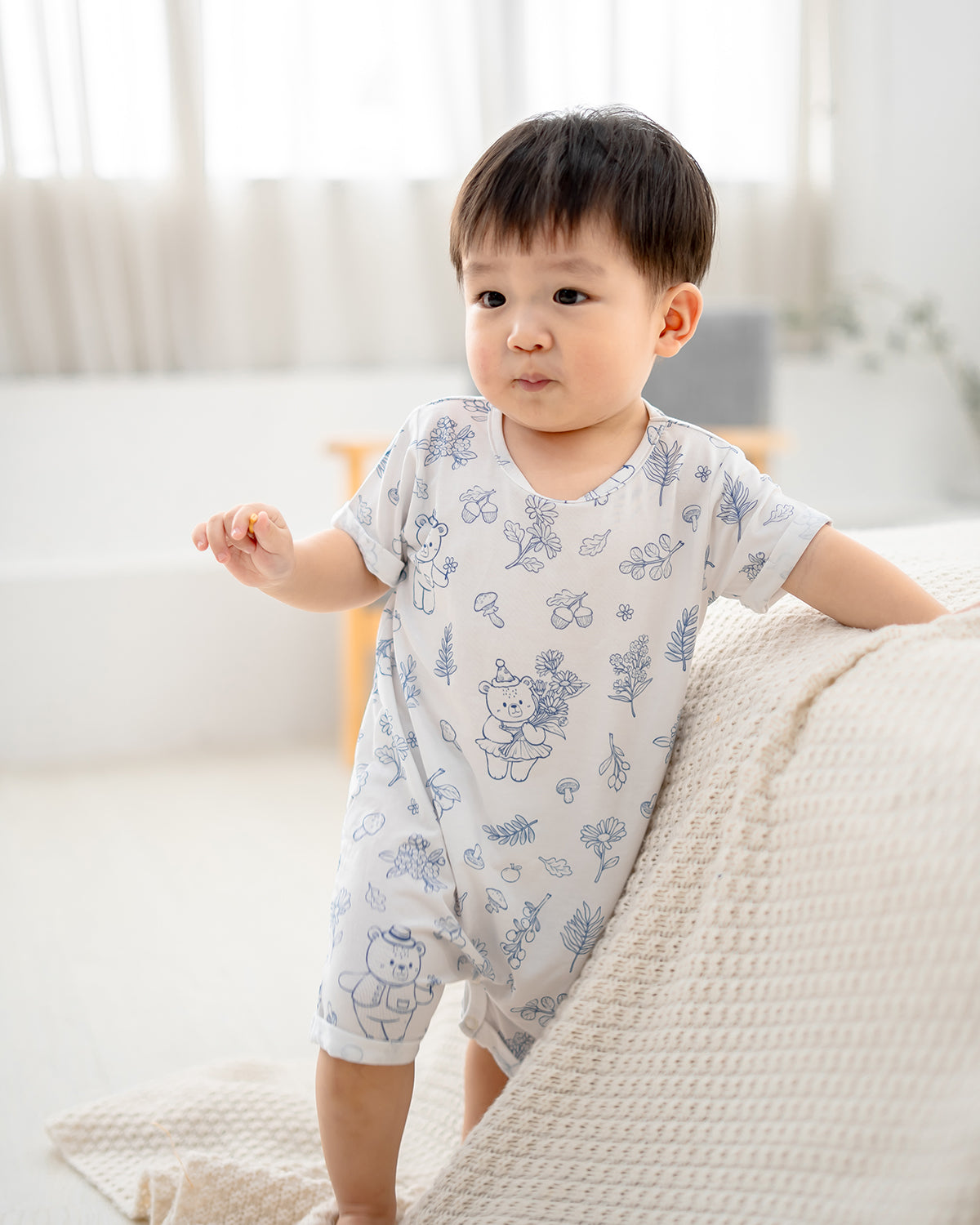 Close-up of LeBear Meadow TENCEL baby romper showing tagless neckline and soft fabric