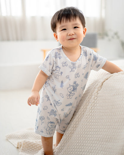 Full body view of baby wearing LeBear Meadow TENCEL baby romper in a minimal home setting