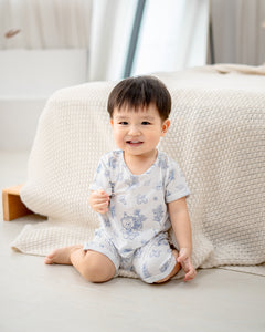 Baby wearing LeBear Meadow TENCEL baby romper sitting comfortably indoors