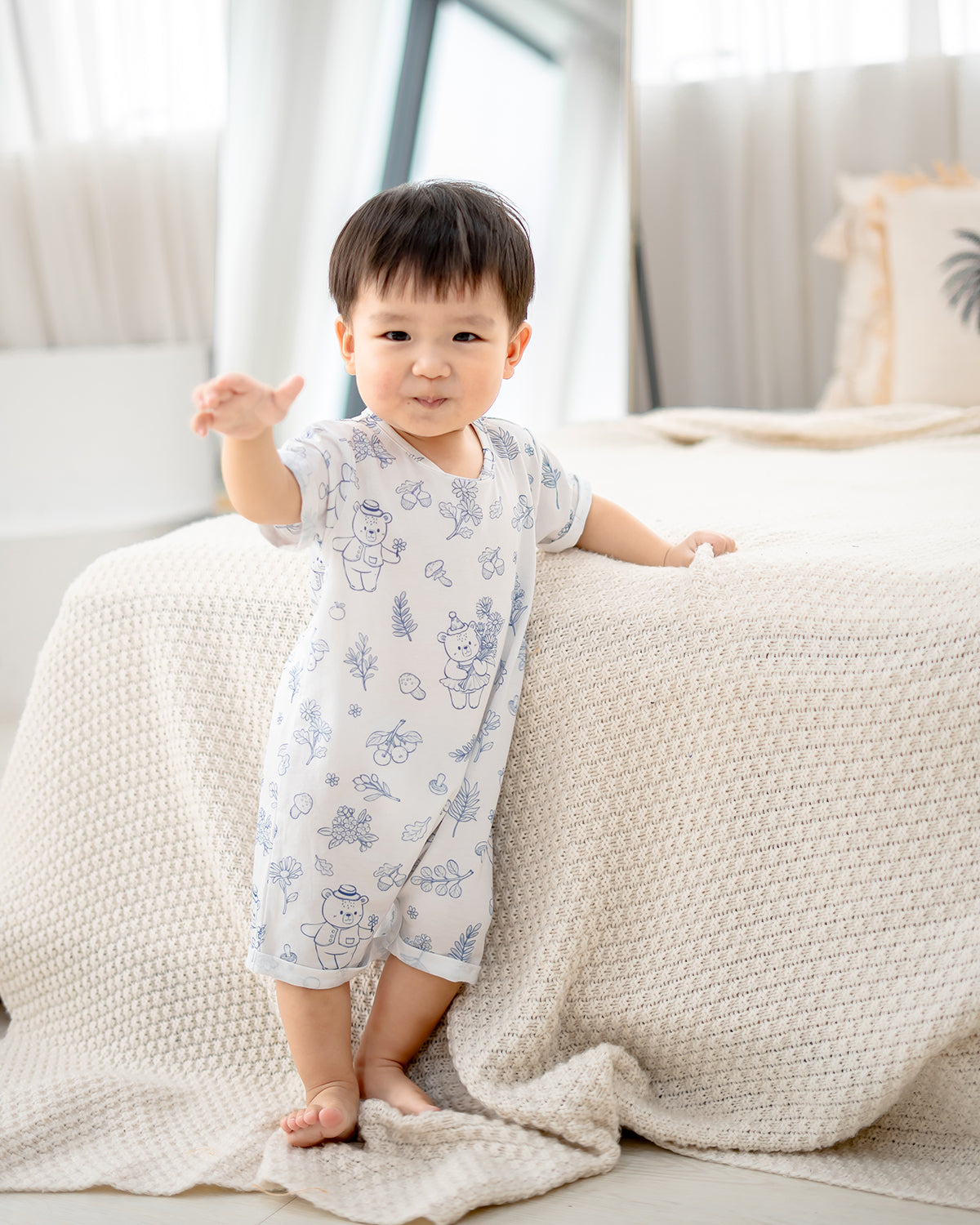Baby standing in LeBear Meadow TENCEL romper made with breathable Lenzing TENCEL