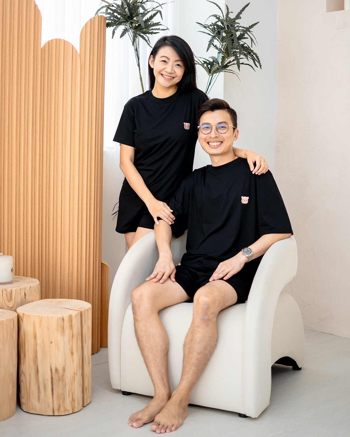 Couple wearing matching LEBEAR TENCEL™ sets in black — minimalist family loungewear.