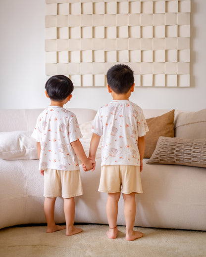 Back view of LeBear Mushroom Bear bamboo kids lounge set with short sleeve top and beige shorts