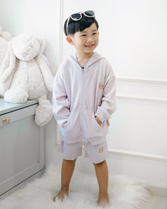 Boy wearing LeBear premium cotton lilac hooded jacket with front zip and bear embroidery, styled with matching shorts