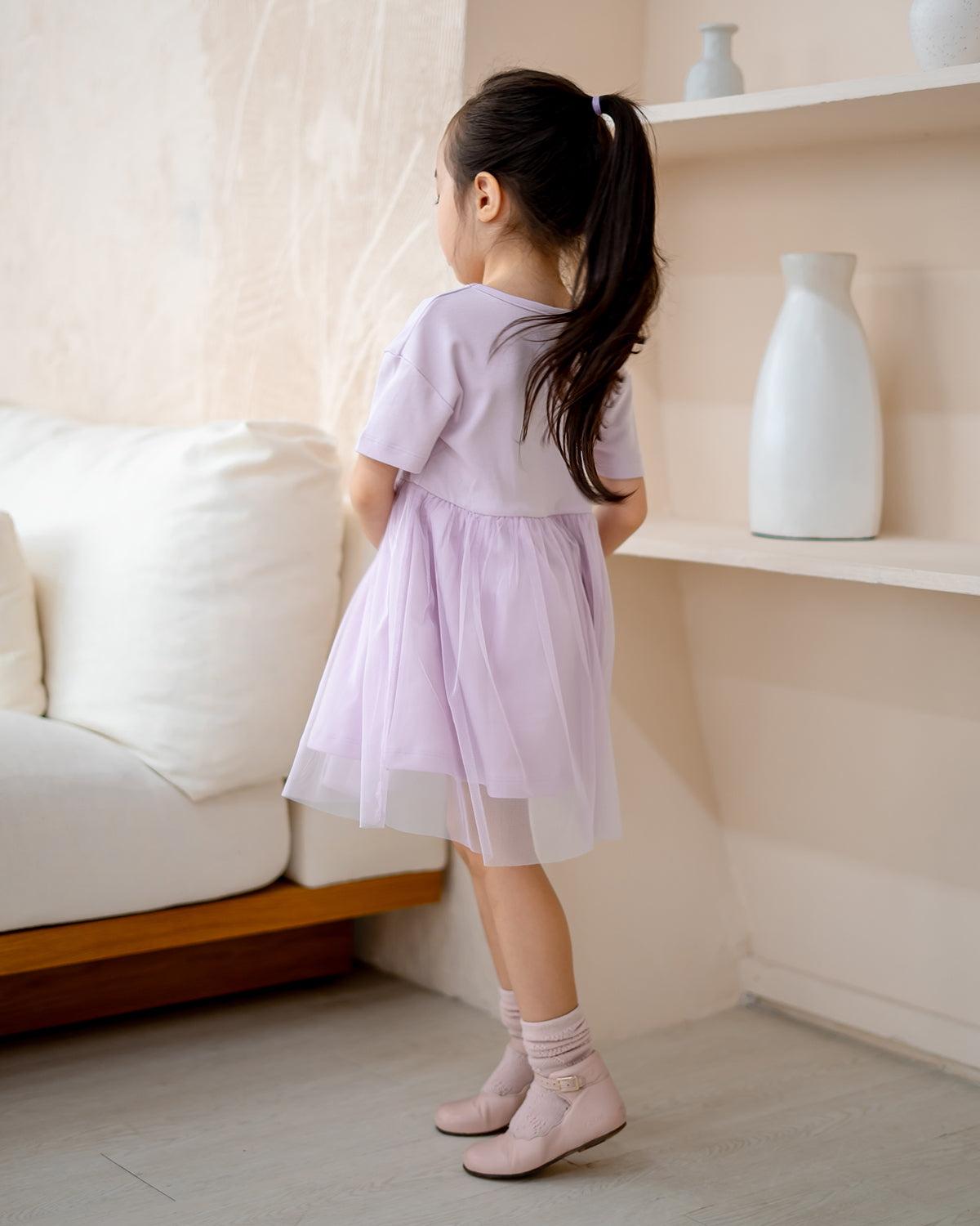 “Back view of LeBear Roselle Tulle Dress in Lilac Mist with layered tulle skirt”