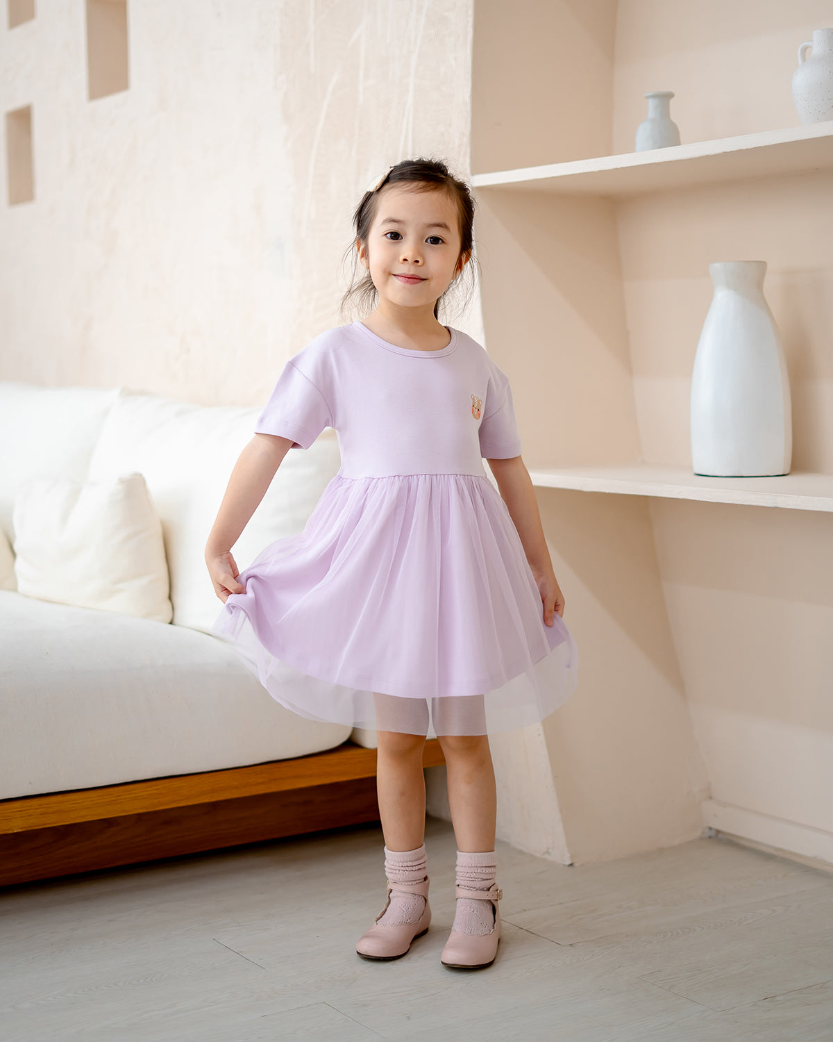 “Girl twirling in LeBear Roselle Tulle Dress – lightweight lilac tulle skirt”