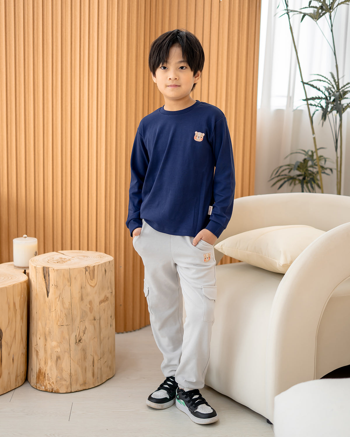 Front view of Lebear signature embroidery long sleeve tee in deep sea blue for kids