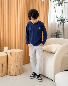 Kid wearing Lebear signature embroidery long sleeve tee in deep sea blue with relaxed everyday fit