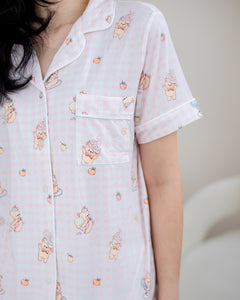 Upper body view of LeBear Sweet Scoop adult bamboo pyjama top featuring soft pink gingham, white piping and exclusive teddy bear print.
