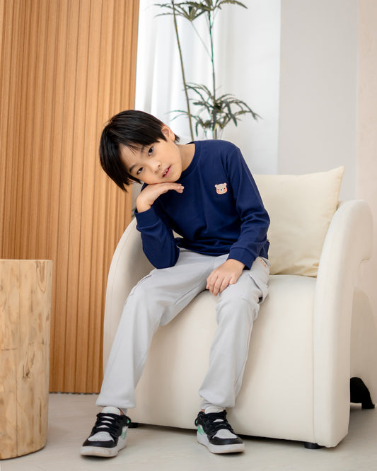 Kids wearing Lebear utility jogger pants in cloud grey styled for everyday comfort and play