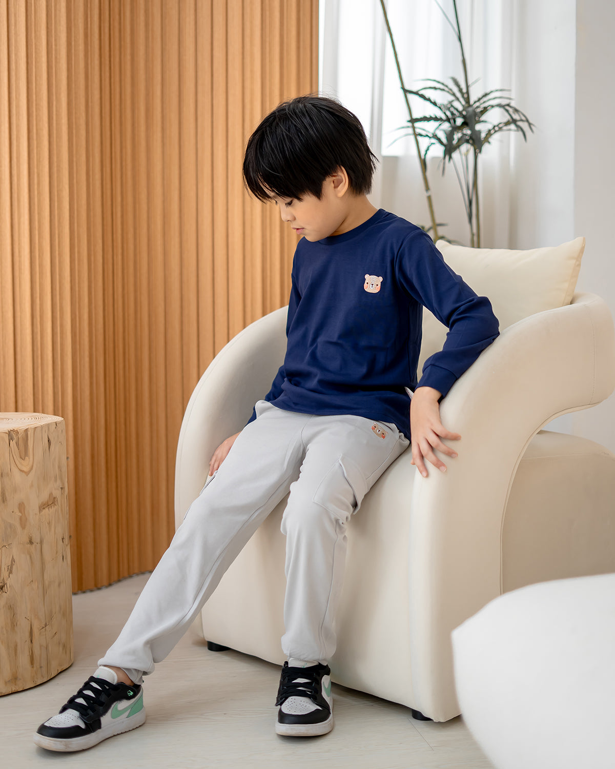 Side view of Lebear utility jogger pants in cloud grey showing relaxed fit and cargo pocket detail