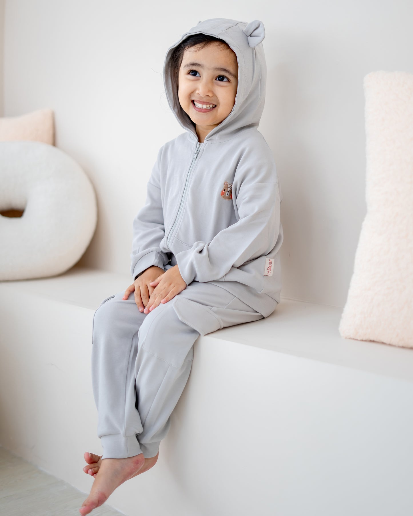 Close up of bear ear hood on LeBear kids cloud grey hooded jacket
