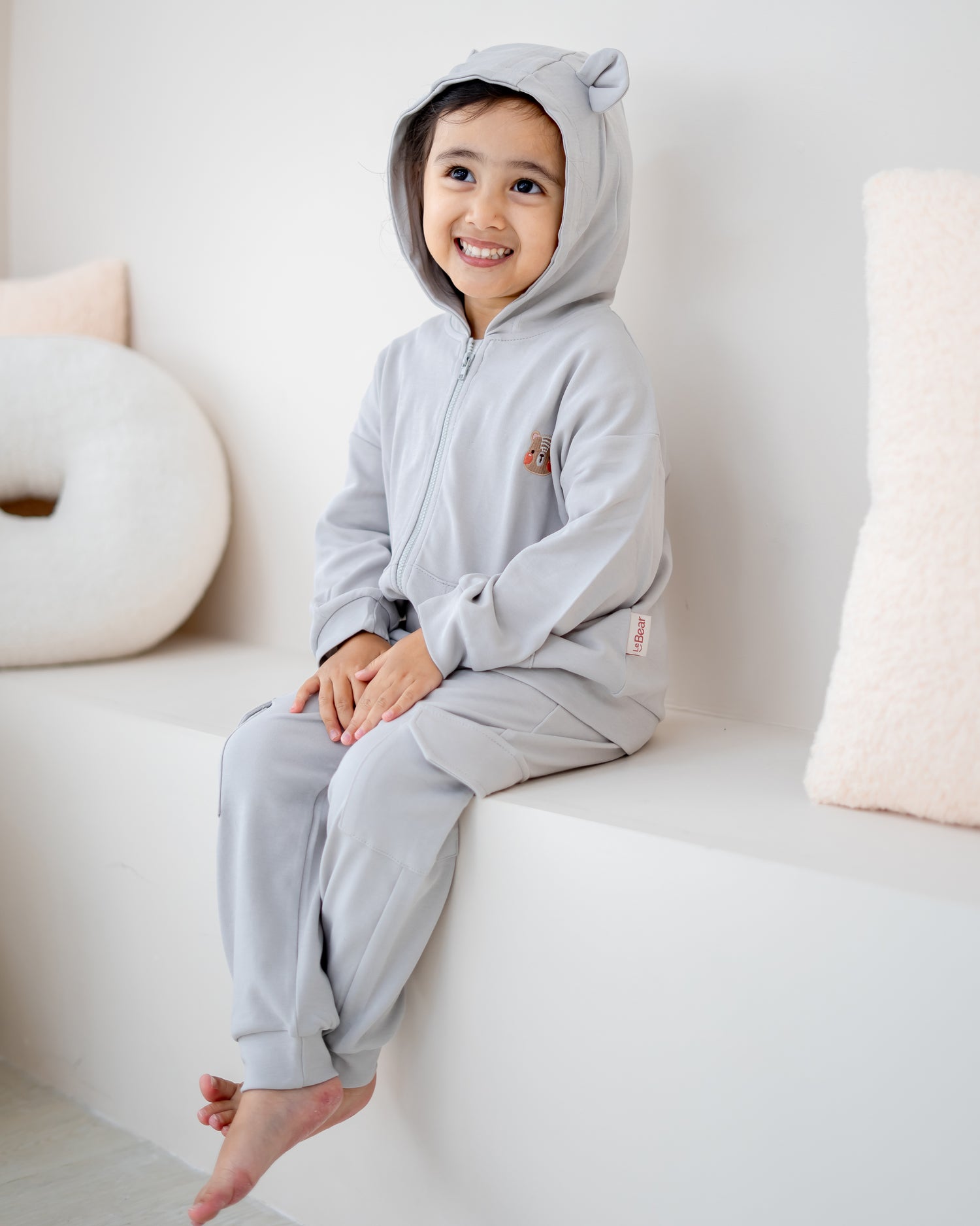 Close up of bear ear hood on LeBear kids cloud grey hooded jacket