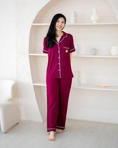 Woman wearing LeBear Wine Red adult bamboo pyjamas with short sleeves, long pants and premium bamboo fabric.