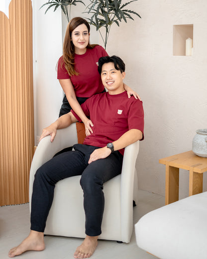 Couple wearing matching LEBEAR red tees – Lunar Blossom family outfit