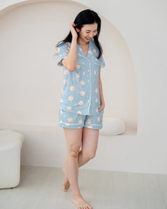 Woman wearing Little Dreamer adult bamboo pyjamas shorts set in aqua blue