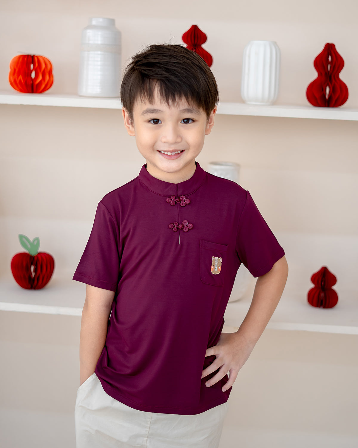 Close-up of bamboo Mandarin top in plum with LeBear embroidery