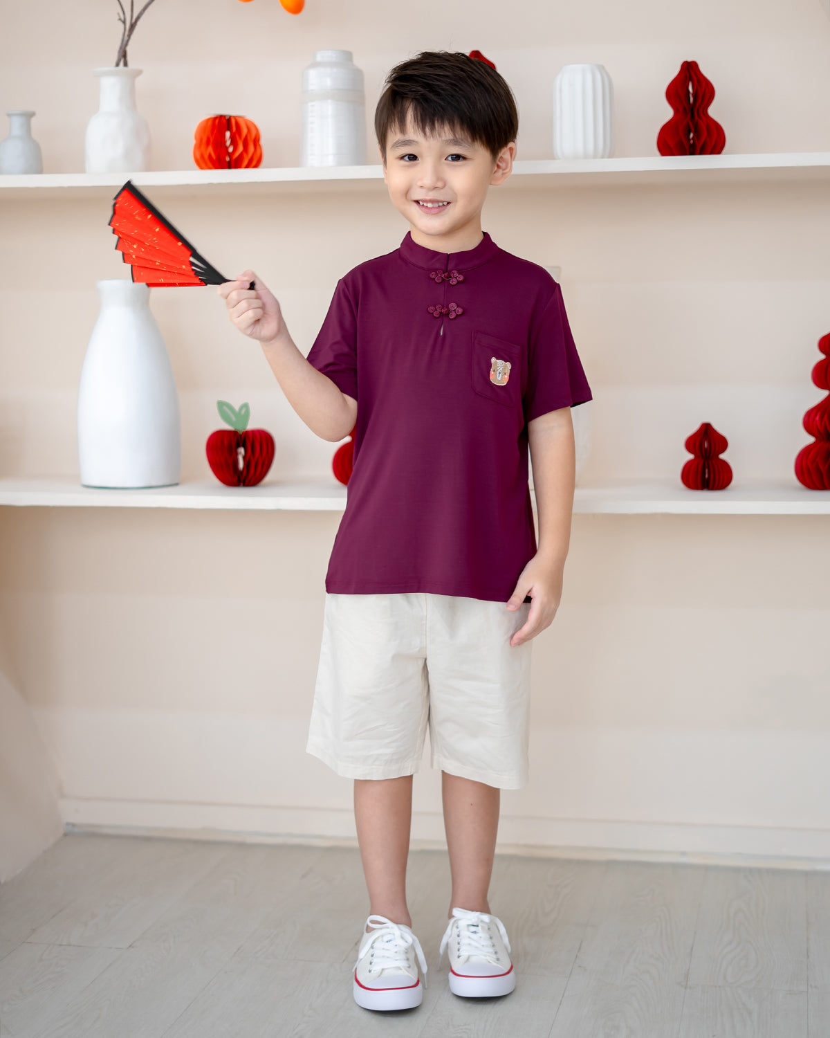 Front view of Plum Blossom Mandarin Set with festive knot buttons