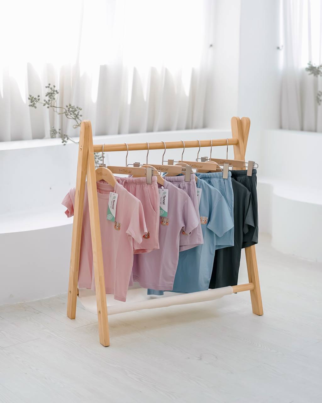 Flat lay of kids skyblue loungewear crafted from eco-friendly TENCEL™ Lyocell, soft and breathable sustainable clothing