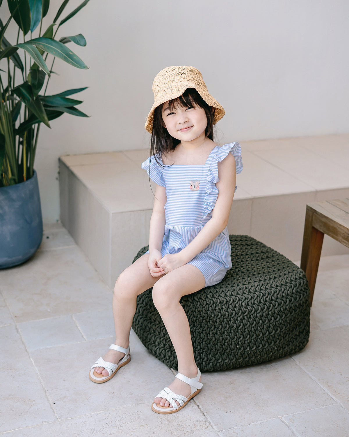 Lightweight Sky Blue striped playsuit with ruffle shoulder details and signature LeBear embroidery.