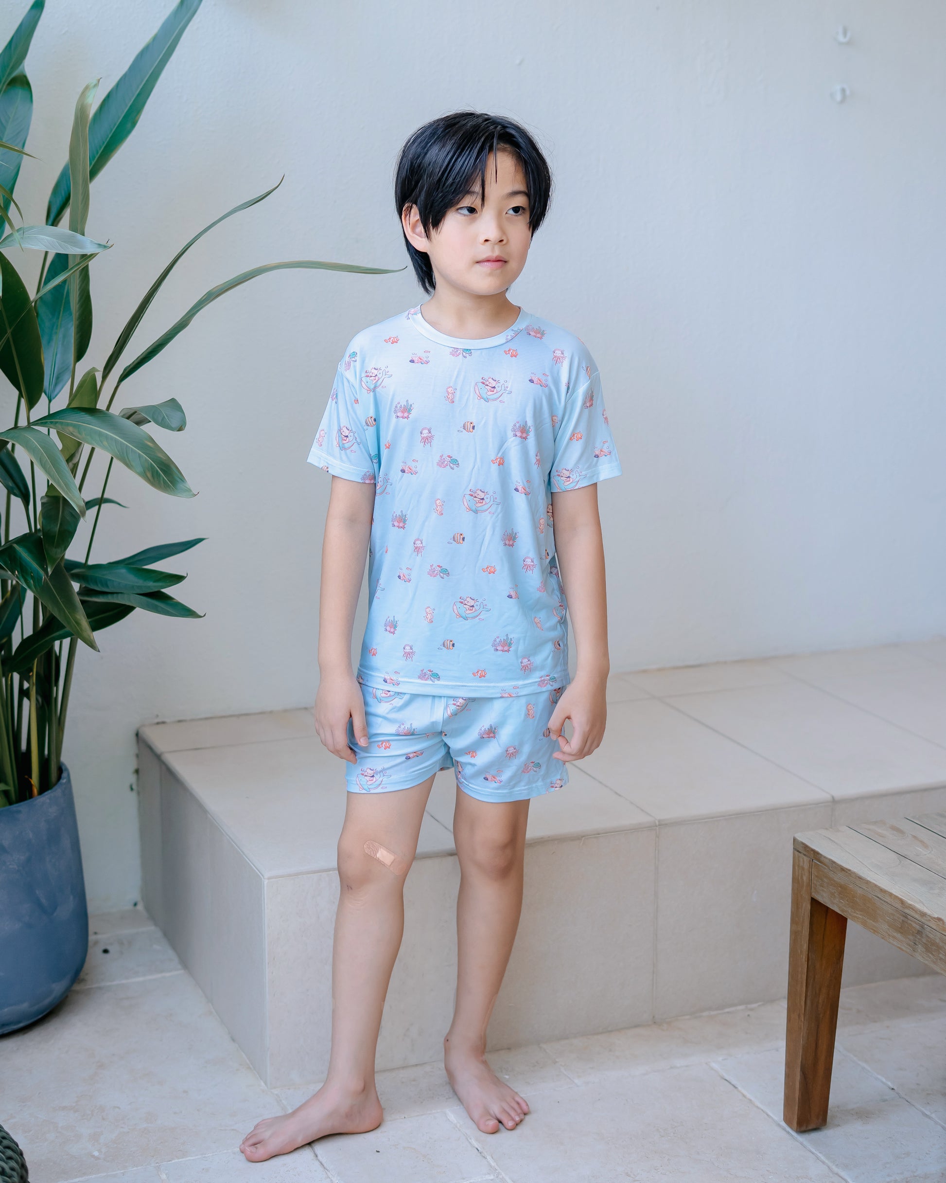 Child wearing LeBear Wander & Wonder Kids Lenzing TENCEL lounge set in Ocean Blue.