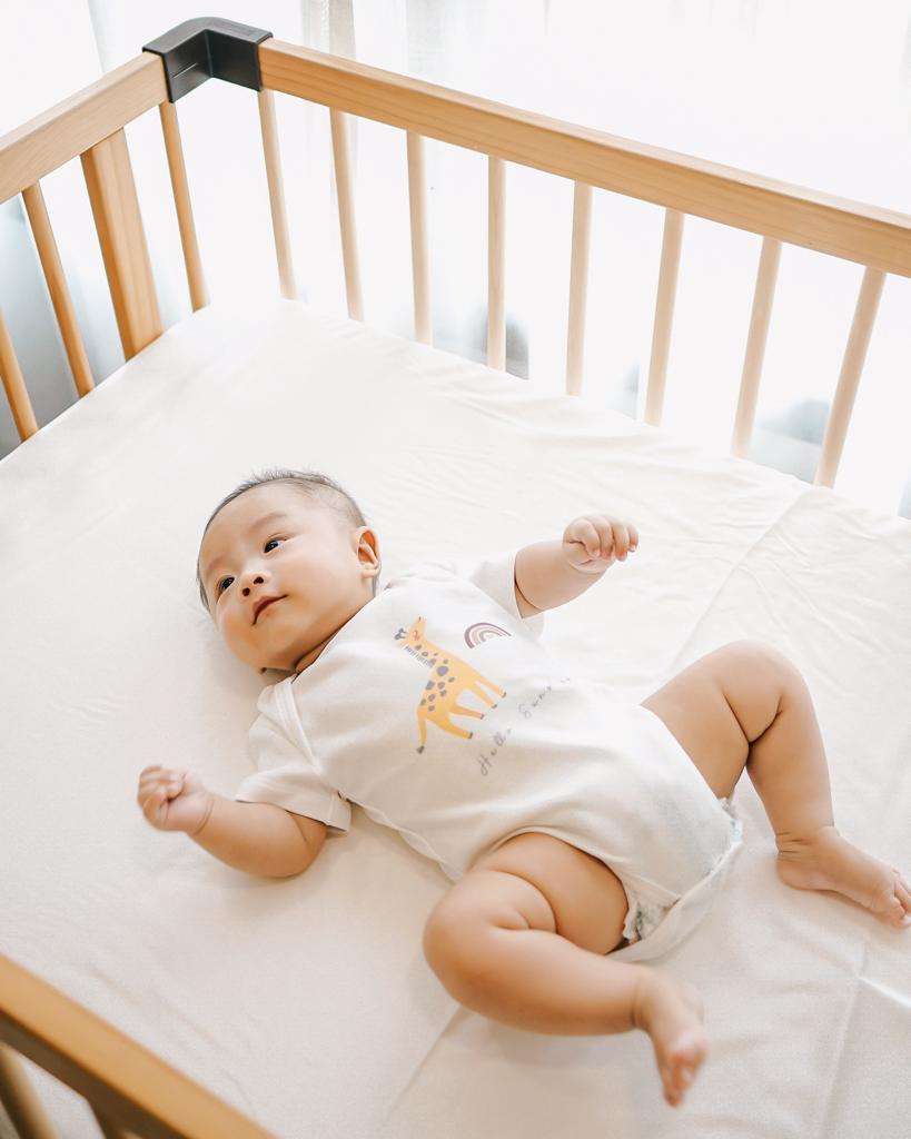 Oak and Sand Baby Cot Sheet in Cloudy Warm White